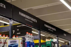 Black Panimoiden parasta signs above drinks shelves in a shop Black Panimoiden parasta signs above drinks shelves in a shop