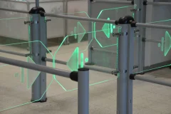 Green illuminated arrows on glass store entrance gates. Green illuminated arrows on glass store entrance gates.