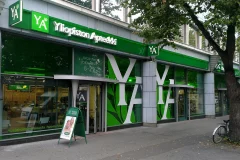Yliopiston Apteekki's green facade with large white YA letters on the windows. Yliopiston Apteekki's green facade with large white YA letters on the windows.