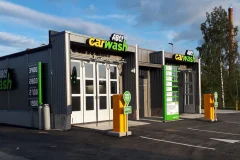 An ABC Carwash facade with illuminated lettering and wash programme price boards.