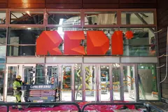 Large red REDI letters above a glass entrance.