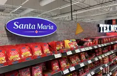 Blue Santa Maria logo sign above shelves of Tex Mex products Blue Santa Maria logo sign above shelves of Tex Mex products